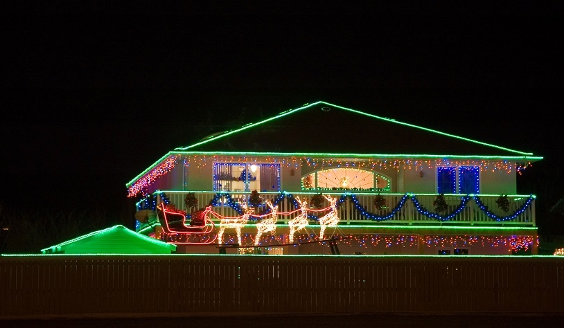 A house covered in thousands of Christmas lights.